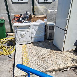 Old appliances being taken to the recycling yard